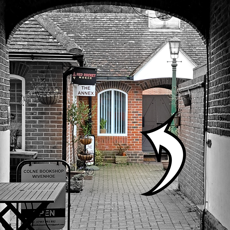 A view through the arch leading into Jolliffe's Yard. In the centre of the image, at the back of the yard is the window for our space. Our door is to the right of the window